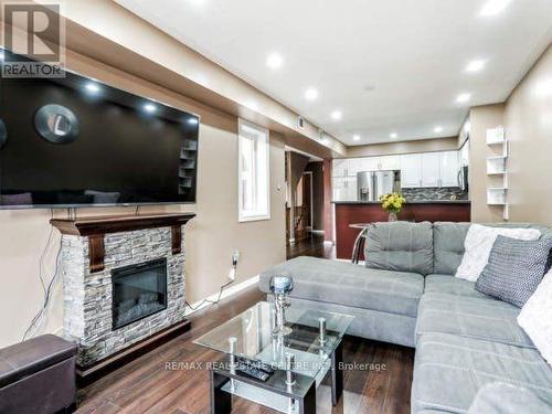 304 - 60 Barondale Drive W, Mississauga, ON - Indoor Photo Showing Living Room With Fireplace