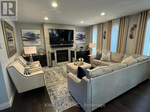 138 Ulster Street, Lasalle, ON - Indoor Photo Showing Living Room With Fireplace