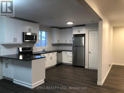 1 - 6785 Margaret Street, Niagara Falls, ON - Indoor Photo Showing Kitchen With Double Sink