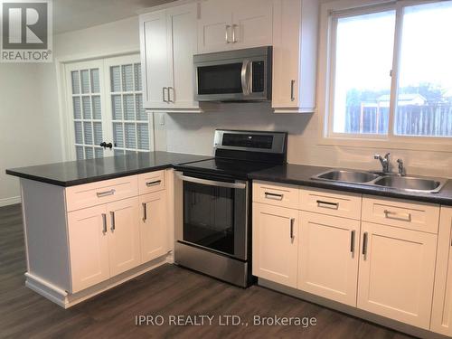 1 - 6785 Margaret Street, Niagara Falls, ON - Indoor Photo Showing Kitchen With Double Sink