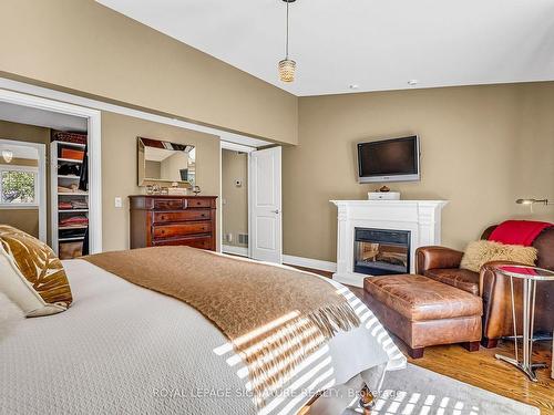 100 Three Valleys Dr, Toronto, ON - Indoor Photo Showing Bedroom With Fireplace