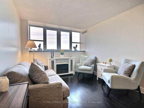 Uph109-797 Don Mills Rd, Toronto, ON - Indoor Photo Showing Living Room With Fireplace