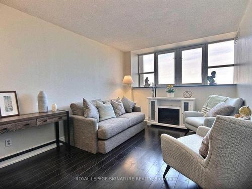 Uph109-797 Don Mills Rd, Toronto, ON - Indoor Photo Showing Living Room With Fireplace