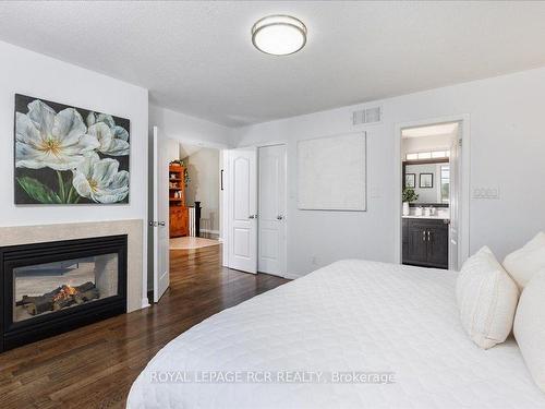 130 Mainprize Cres, East Gwillimbury, ON - Indoor Photo Showing Bedroom With Fireplace