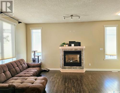 31 701 Mcintosh Street E, Swift Current, SK - Indoor Photo Showing Living Room With Fireplace