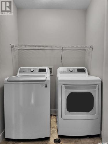 214 Stilling Union, Saskatoon, SK - Indoor Photo Showing Laundry Room