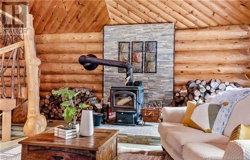 50 Chemin Duval, Petit-Paquetville, NB - Indoor Photo Showing Living Room With Fireplace