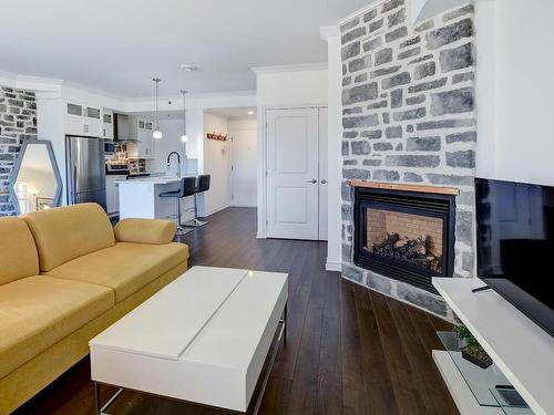 Living room - 308-1440 Av. De Rochechouart, Saint-Jérôme, QC - Indoor Photo Showing Living Room With Fireplace