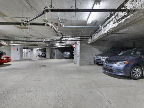 Garage - 5-25 Place Charles-Lemoyne, Sainte-Catherine, QC - Indoor Photo Showing Garage