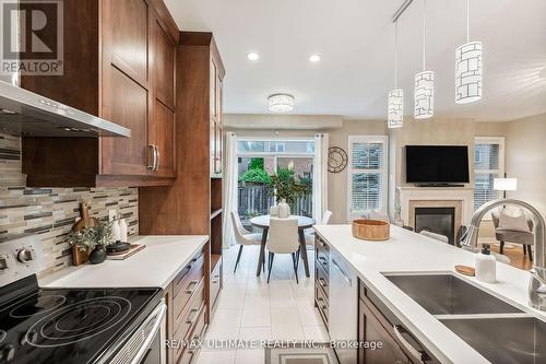 23 Atlas Peak Drive, Markham, ON - Indoor Photo Showing Kitchen With Fireplace With Double Sink