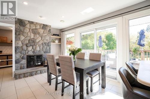 595 Big Bay Point Road, Barrie, ON - Indoor Photo Showing Dining Room With Fireplace