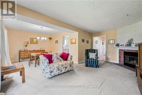 7715 Swan Street, Niagara Falls, ON - Indoor Photo Showing Living Room With Fireplace