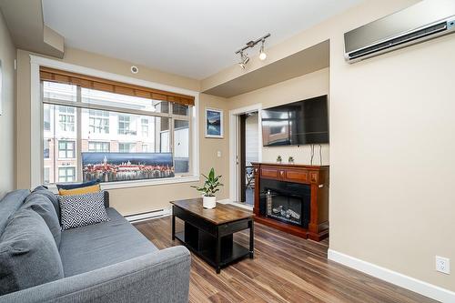 302 8157 207 Street, Langley, BC - Indoor Photo Showing Living Room With Fireplace