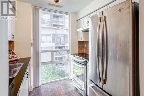 407 - 5 Michael Power Place, Toronto, ON - Indoor Photo Showing Kitchen With Double Sink