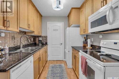 102B 1121 Mckercher Drive, Saskatoon, SK - Indoor Photo Showing Kitchen With Double Sink