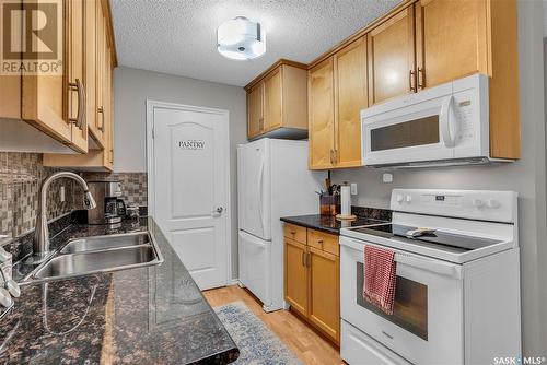 102B 1121 Mckercher Drive, Saskatoon, SK - Indoor Photo Showing Kitchen With Double Sink