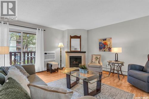 102B 1121 Mckercher Drive, Saskatoon, SK - Indoor Photo Showing Living Room With Fireplace