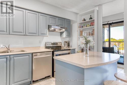 518 - 1000 Cedarglen Gate, Mississauga, ON - Indoor Photo Showing Kitchen With Double Sink