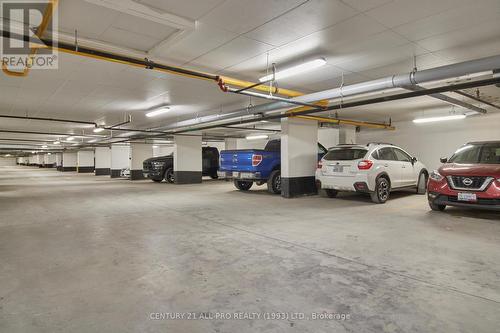 210 - 70 Shipway Avenue, Clarington (Newcastle), ON - Indoor Photo Showing Garage