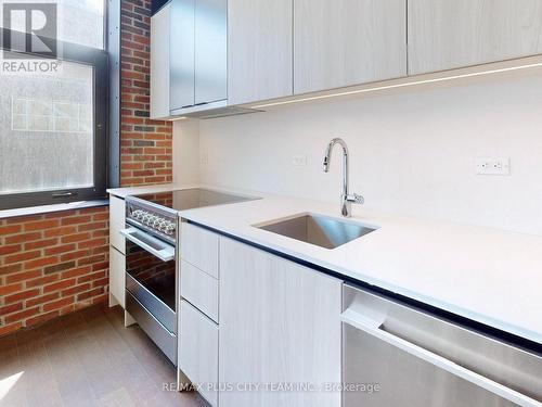 206 - 150 Logan Avenue, Toronto, ON - Indoor Photo Showing Kitchen