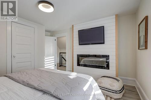 84 Ross Street, St. Thomas, ON - Indoor Photo Showing Bedroom With Fireplace