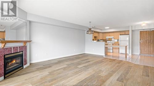 1995 Normandy Street Unit# 306, Lasalle, ON - Indoor Photo Showing Living Room With Fireplace