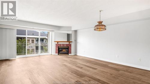 1995 Normandy Street Unit# 306, Lasalle, ON - Indoor Photo Showing Living Room With Fireplace