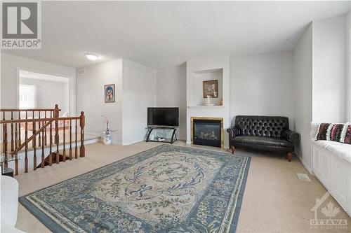 412 June Court, Ottawa, ON - Indoor Photo Showing Living Room With Fireplace