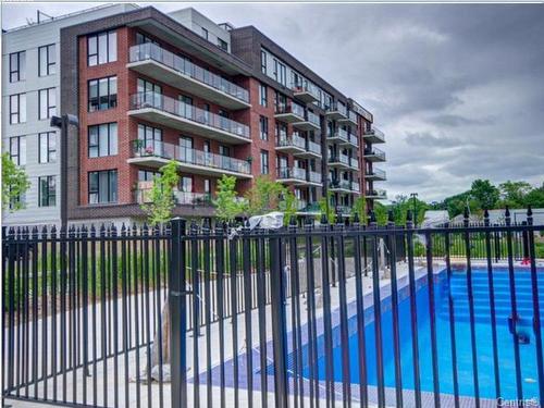 Piscine - 607-6 Av. Donegani, Pointe-Claire, QC - Outdoor With Balcony With Facade