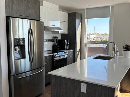 Cuisine - 603-40 Rue D'Ambre, Candiac, QC - Indoor Photo Showing Kitchen With Upgraded Kitchen