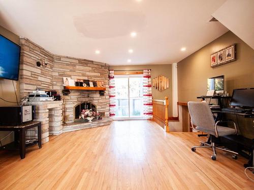 Family room - 45 Rue Boyer, Saint-Constant, QC - Indoor Photo Showing Office With Fireplace