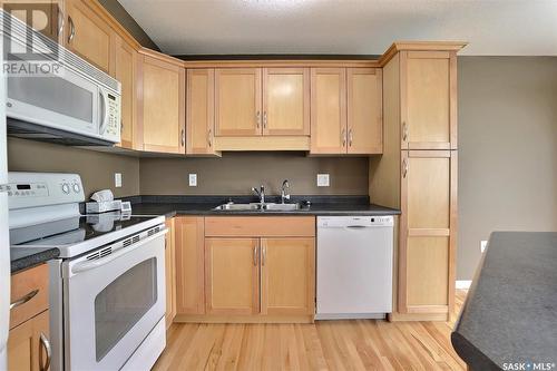 58 3101 Tregarva Drive E, Regina, SK - Indoor Photo Showing Kitchen With Double Sink