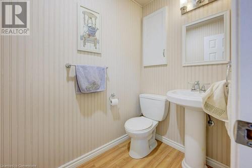 Main floor 2pc bath beside laundry - 61 Renwick Avenue, Cambridge, ON - Indoor Photo Showing Bathroom