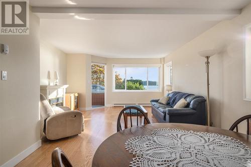 Dining space with beam ceiling and light wood-type flooring - 101 145 Newcastle Ave, Nanaimo, BC - Indoor