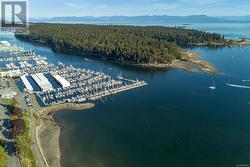 Aerial view featuring a water and mountain view - 