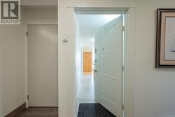 Hall with wood-type flooring - 