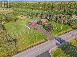 This home rests on just over an acre. Large side yard - perfect for kids, pets or maybe an additional detached garage in the future! - 