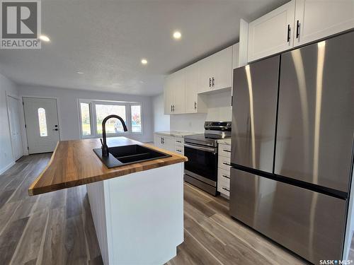 226 Douglas Road, Weyburn, SK - Indoor Photo Showing Kitchen With Double Sink