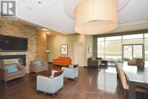 1805 - 215 Queen Street E, Brampton, ON - Indoor With Fireplace