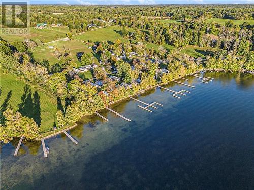 Aerial showing sand bottom and dock - 538 Clear Lake Road, Elgin, ON - Outdoor With Body Of Water With View