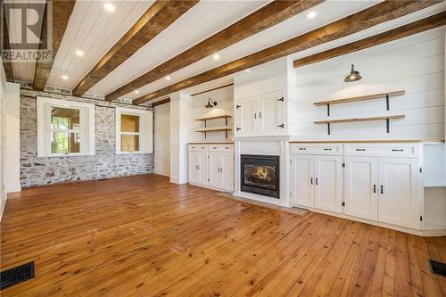 Living room with fireplace and build-ins - 538 Clear Lake Road, Elgin, ON - Indoor With Fireplace