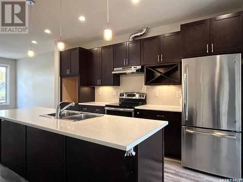 1317 8Th Avenue N, Saskatoon, SK - Indoor Photo Showing Kitchen With Stainless Steel Kitchen With Double Sink With Upgraded Kitchen