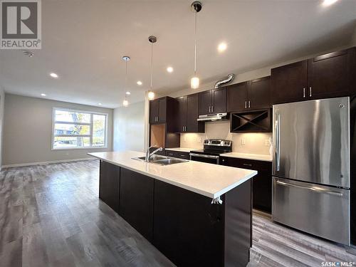 1317 8Th Avenue N, Saskatoon, SK - Indoor Photo Showing Kitchen With Stainless Steel Kitchen With Double Sink With Upgraded Kitchen