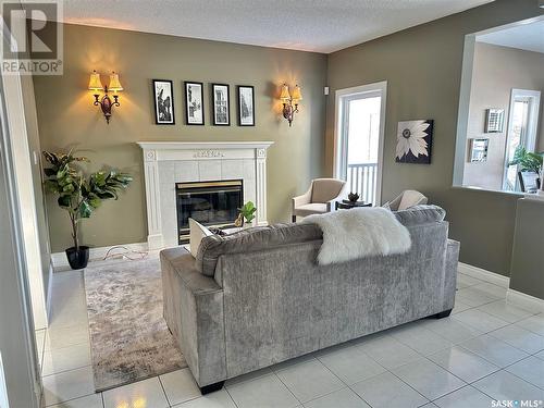 5018 Wascana Vista Court, Regina, SK - Indoor Photo Showing Living Room With Fireplace