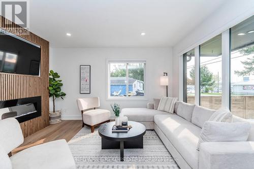 205 Hoyt Avenue, Tay, ON - Indoor Photo Showing Living Room With Fireplace