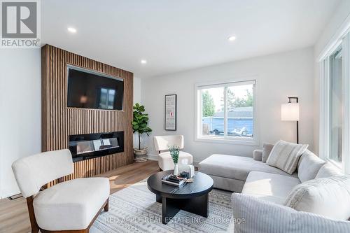 205 Hoyt Avenue, Tay, ON - Indoor Photo Showing Living Room With Fireplace