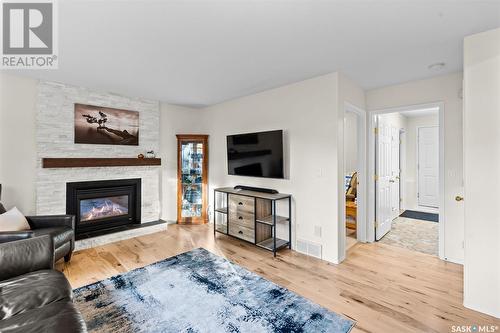 247 Briarvale Bay, Saskatoon, SK - Indoor Photo Showing Living Room With Fireplace