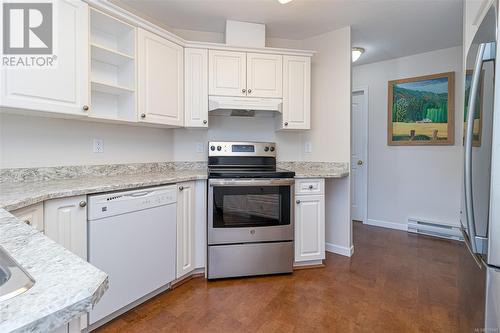 Kitchen updated fridge, stove and countertops - 301 245 First St, Duncan, BC - Indoor Photo Showing Kitchen