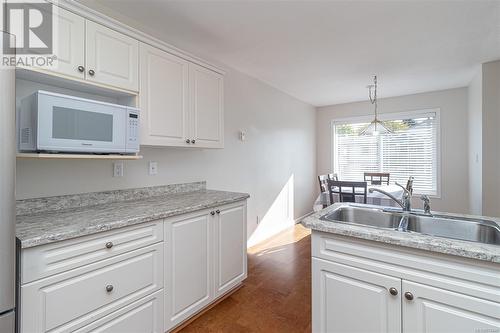 Kitchen updated fridge, stove and countertops - 301 245 First St, Duncan, BC - Indoor Photo Showing Kitchen With Double Sink