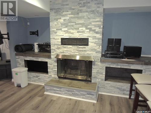 709 Jubilee Place, Estevan, SK - Indoor Photo Showing Living Room With Fireplace